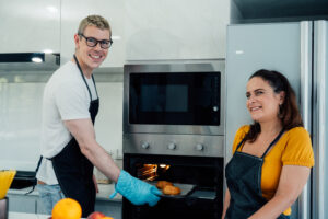 Happy family cooking together on kitchen with kids, Home recreation and food preparation on weekend.